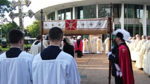 members of St Louis Assembly holding the canopy for Corpus Christi at the Cathedral Basilica